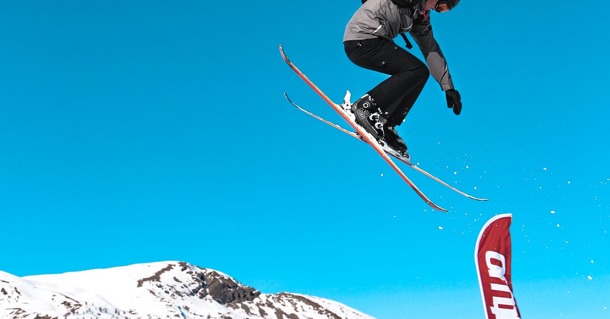 A man flying through the air on a snow board
